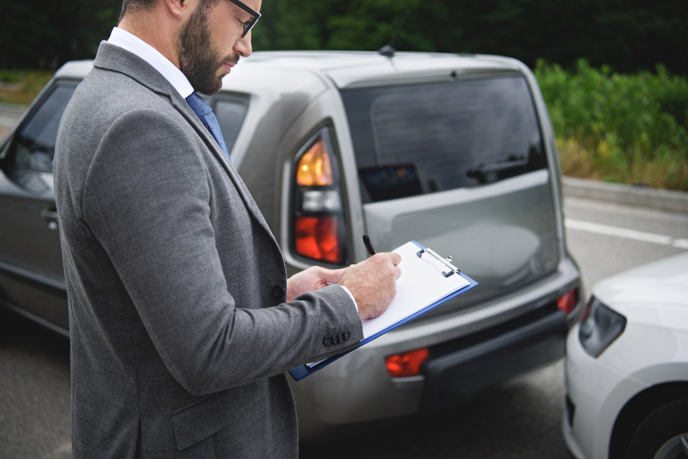 Insurance information being collected for a personal injury attorney after a road traffic accident